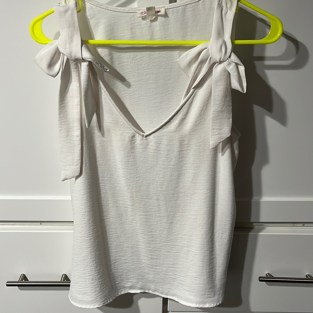 White blouse with bow detail